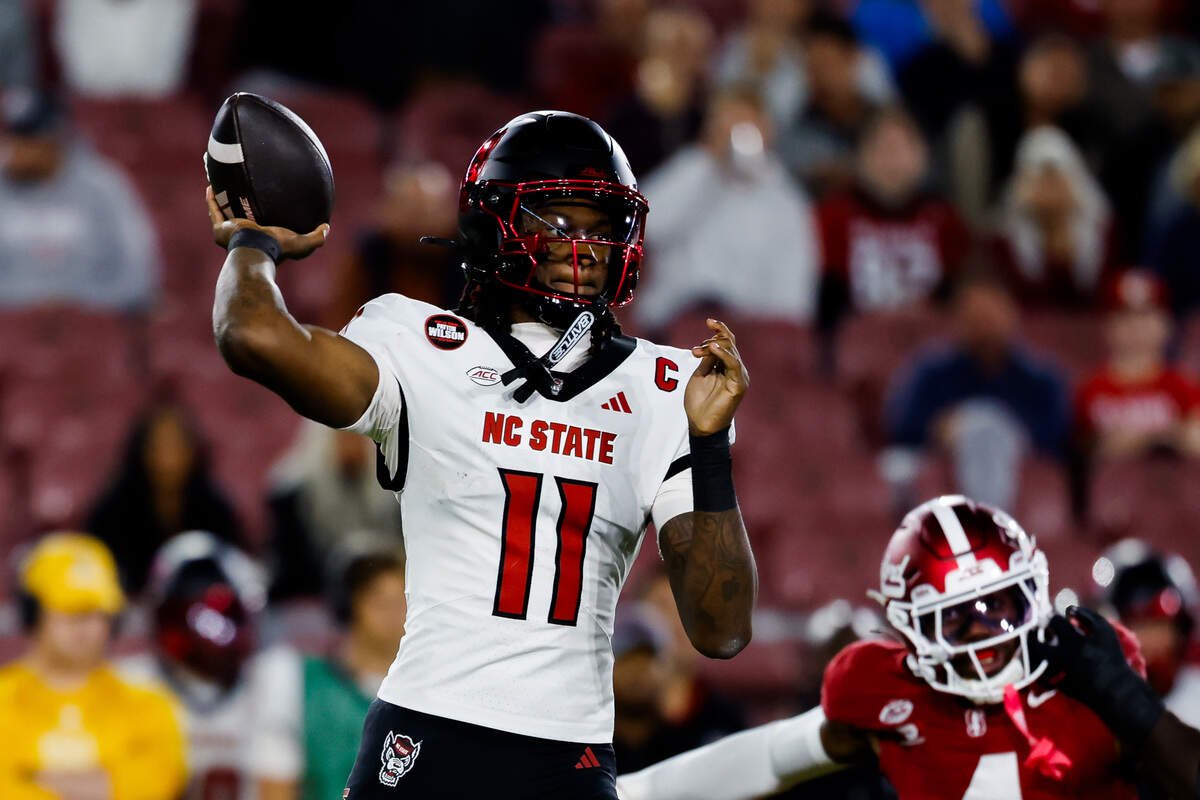 Oct 23, 2026; Stanford, California, USA; NC State Wolfpack quarterback CJ Bailey (11) throws a pass during the first quarter against the Stanford Cardinal at Stanford Stadium.