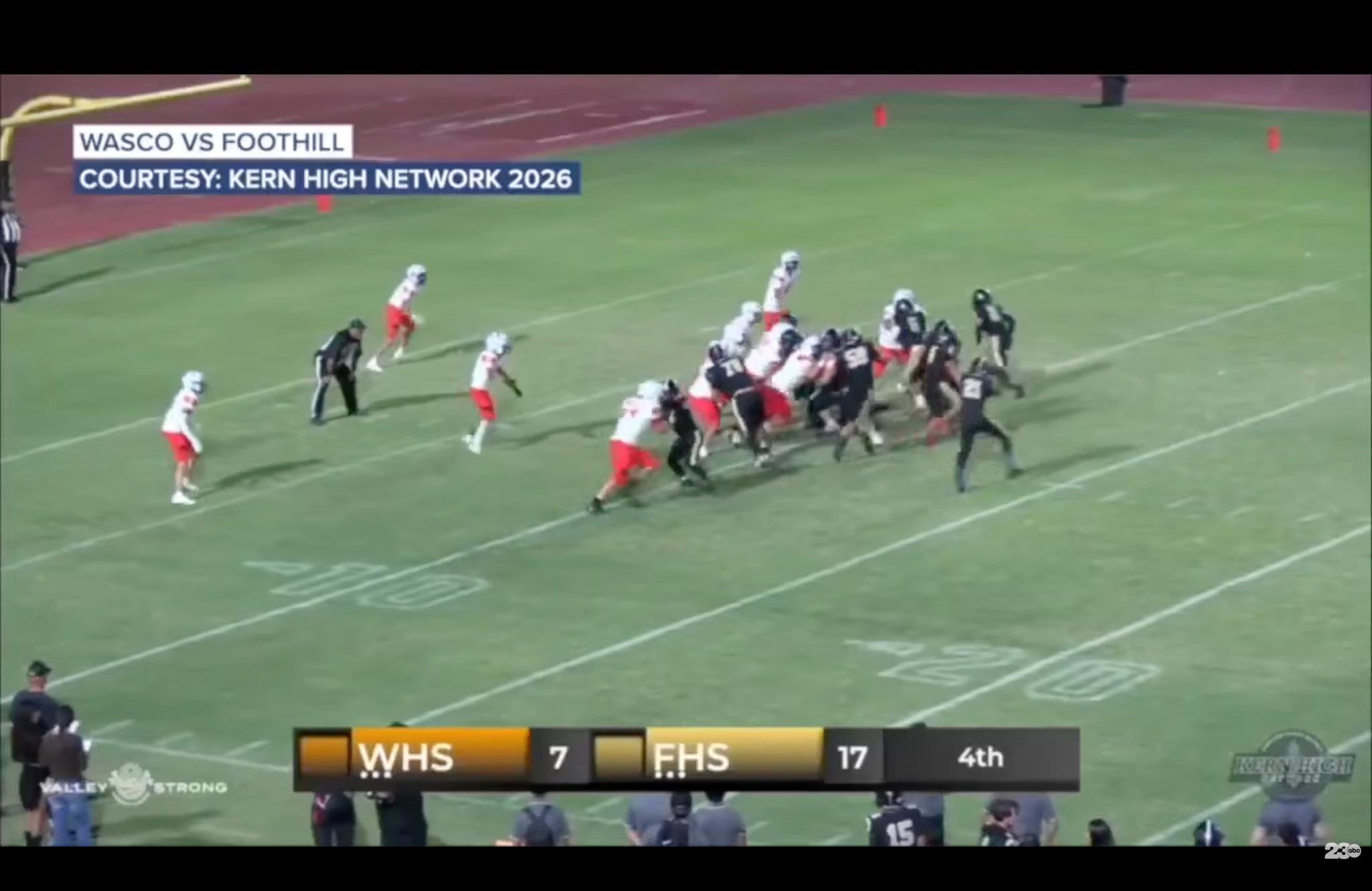An overhead shot of a high school football game between Wasco and Foothill, with a score of WHS 7 and FHS 17 in the fourth quarter.