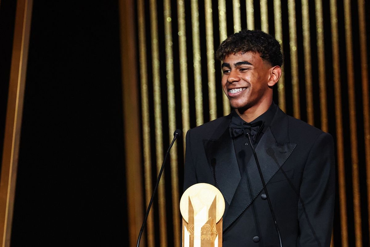 Barcelona's Spanish forward Lamine Yamal receives the Kopa Trophy for best under-21 player during the 2024 Ballon d'Or France Football award ceremony
