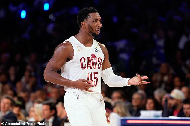 Cleveland Cavaliers' Donovan Mitchell celebrates after scoring during the first half of an NBA basketball game against the Philadelphia 76ers Thursday, Oct. 22, 2026, in Philadelphia. (AP Photo/Matt Slocum)