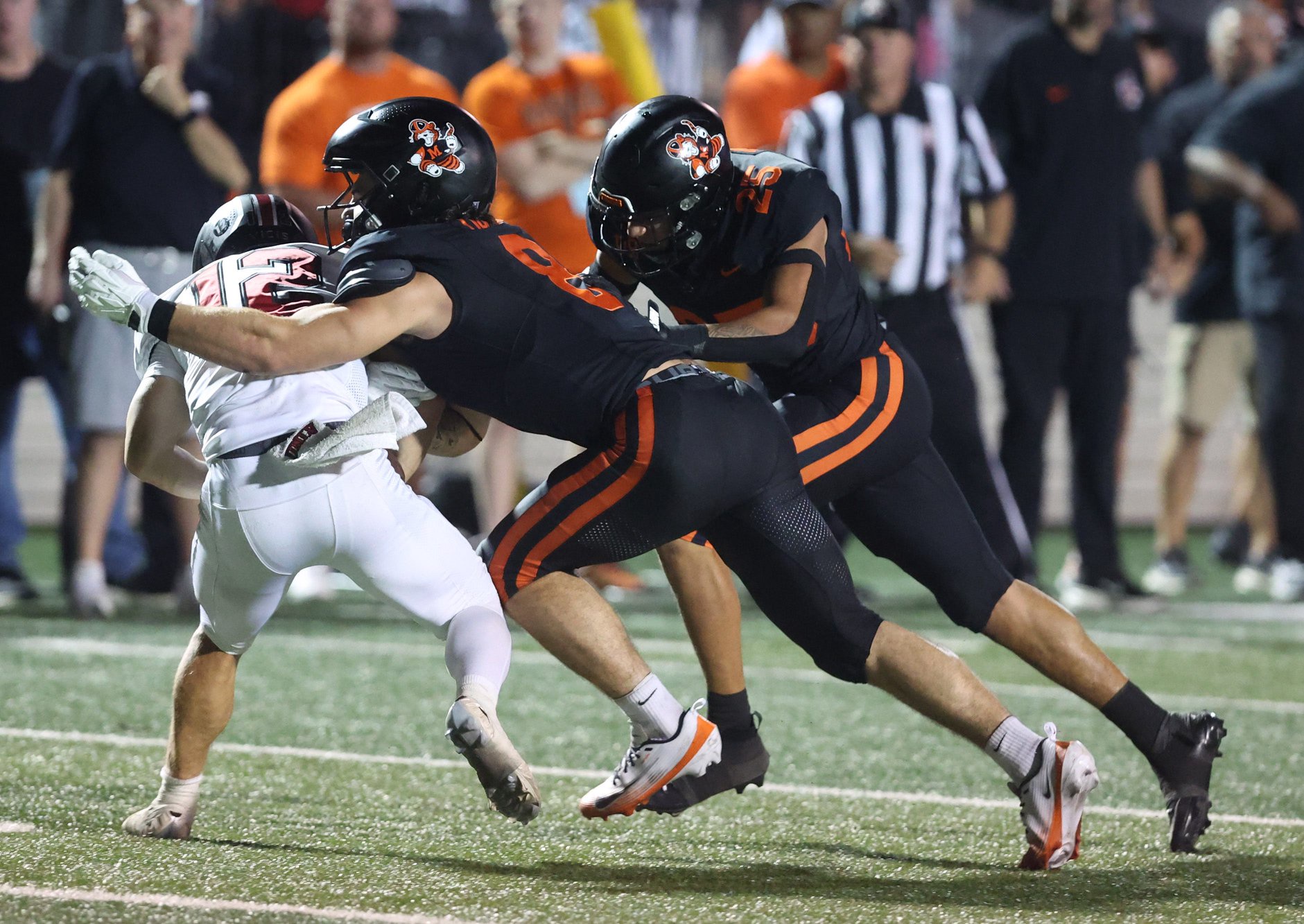 Massillon’s Brydon Feister (8) makes a tackle in his team's home win over Glenville, Friday, Aug. 21, 2026.