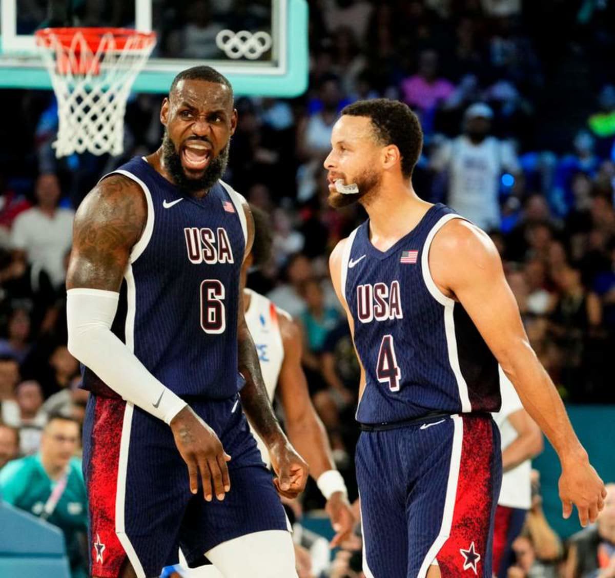 Aug 10, 2024; Paris, France; United States guard Lebron James (6) and United States shooting guard Stephen Curry (4) in the men's basketball gold medal game during the Paris 2024 Olympic Summer Games at Accor Arena. © Rob Schumacher-USA TODAY Sports