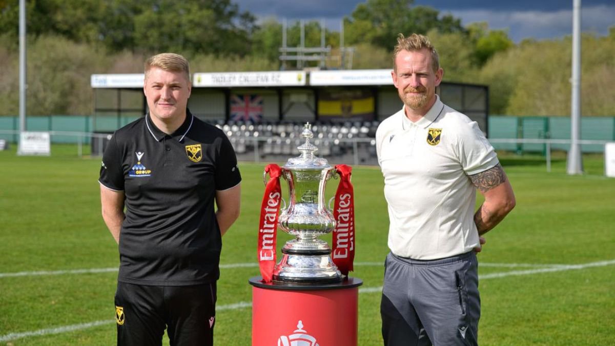 Joe Lawler and Michael Buck with the FA Cup. Photo: Rob Mellor.