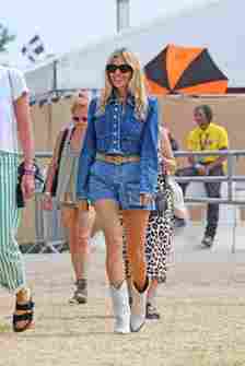 Sienna Miller attends day five of Glastonbury wearing double denim and white cowboy boots