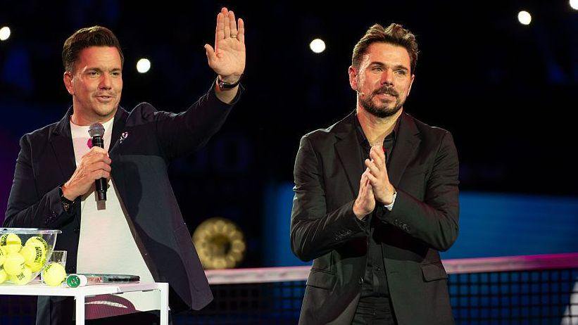 Stan Wawrinka, in a dark jacket, applauds as he is feted in Basel