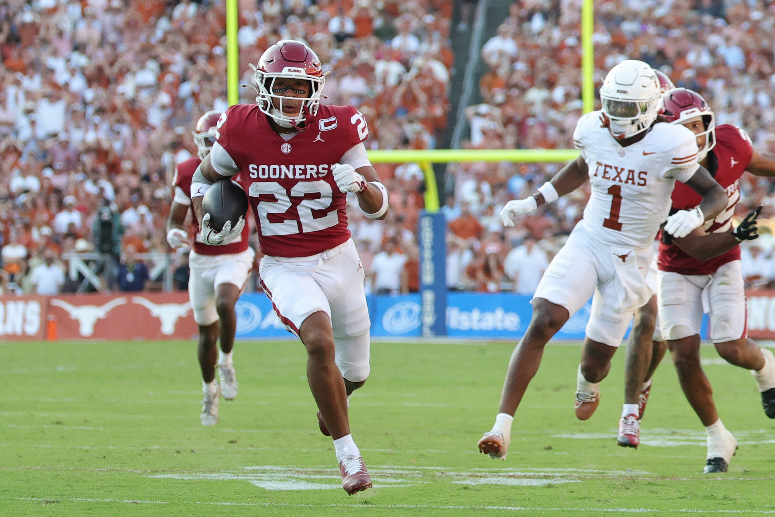 Oct 10, 2026; Dallas, Texas, USA;  Oklahoma Sooners defensive back Peyton Bowen (22) runs to score a touchdown against the Texas Longhorns during the second half at Cotton Bowl.  Mandatory Credit: Kevin Jairaj-Imagn Images
