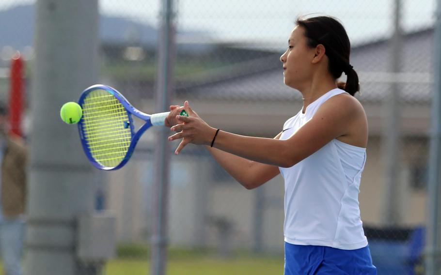 Michaela Kim hits a forehand.