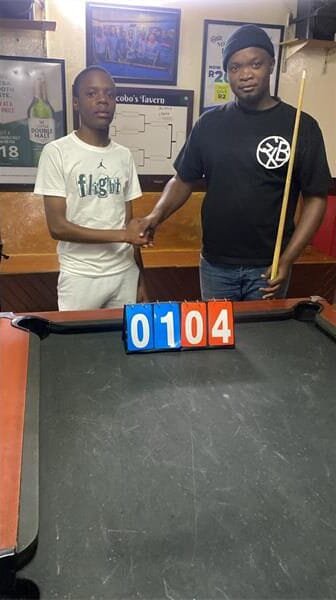 two men at a pool table