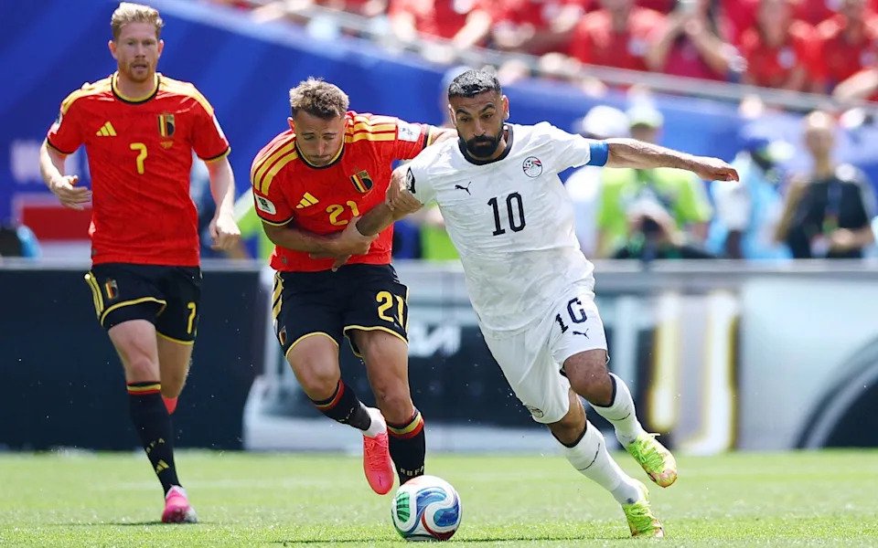 Mohamed Salah fends off Belgium's Timothy Castagne
