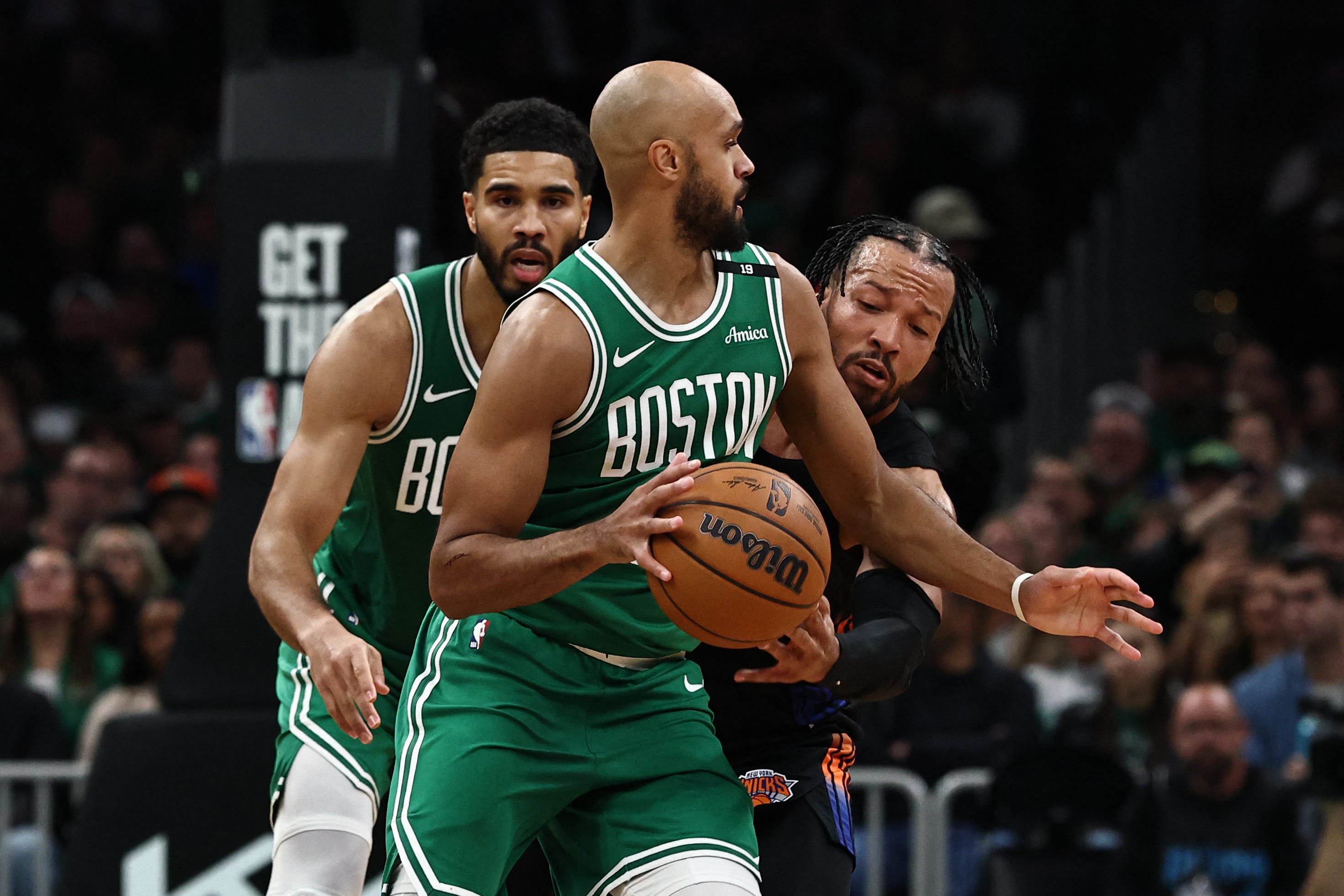 Oct 23, 2026; Boston, Massachusetts, USA; New York Knicks guard Jalen Brunson (11) reaches around to try to kinock the ball away from Boston Celtics guard Derrick White (9) during the second quarter at TD Garden. Mandatory Credit: Winslow Townson-Imagn Images