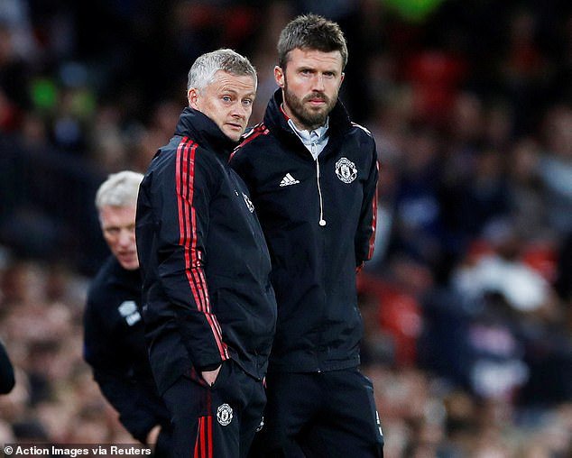 Michael Carrick says he is spoken with Ole Gunner Solskjaer (left) and Sir Alex Ferguson (not pictured) as he fights to save his job