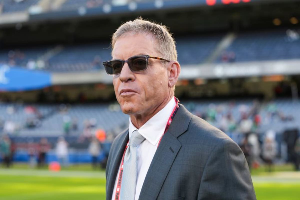 ESPN analyst Troy Aikman looks on