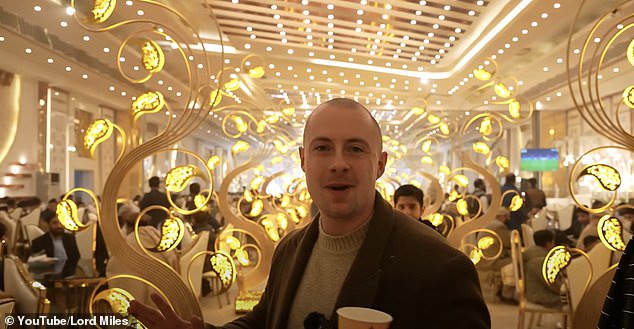 Enormous gold ornaments lined the path to the front of the wedding