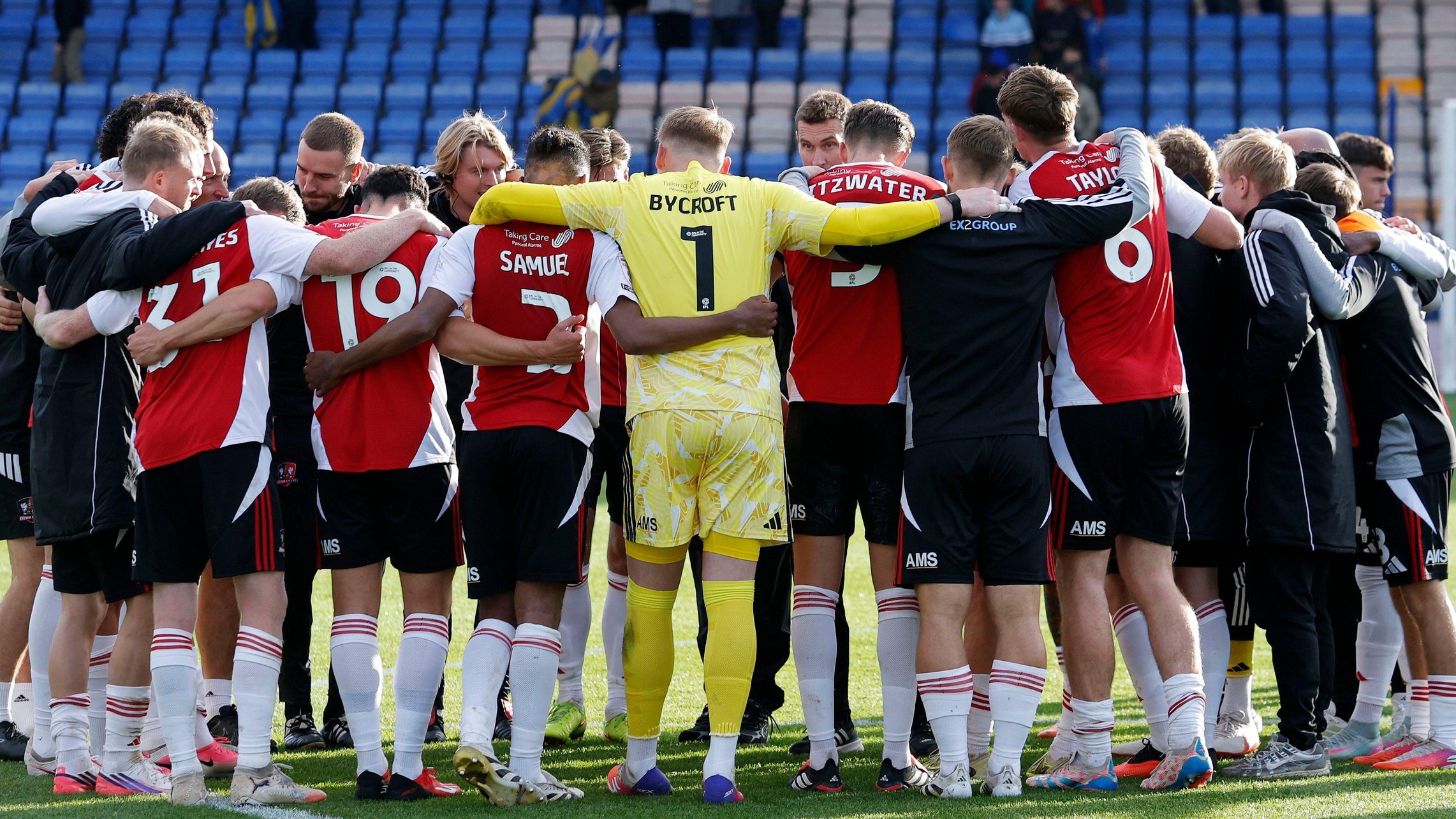 Exeter City players in a huddle