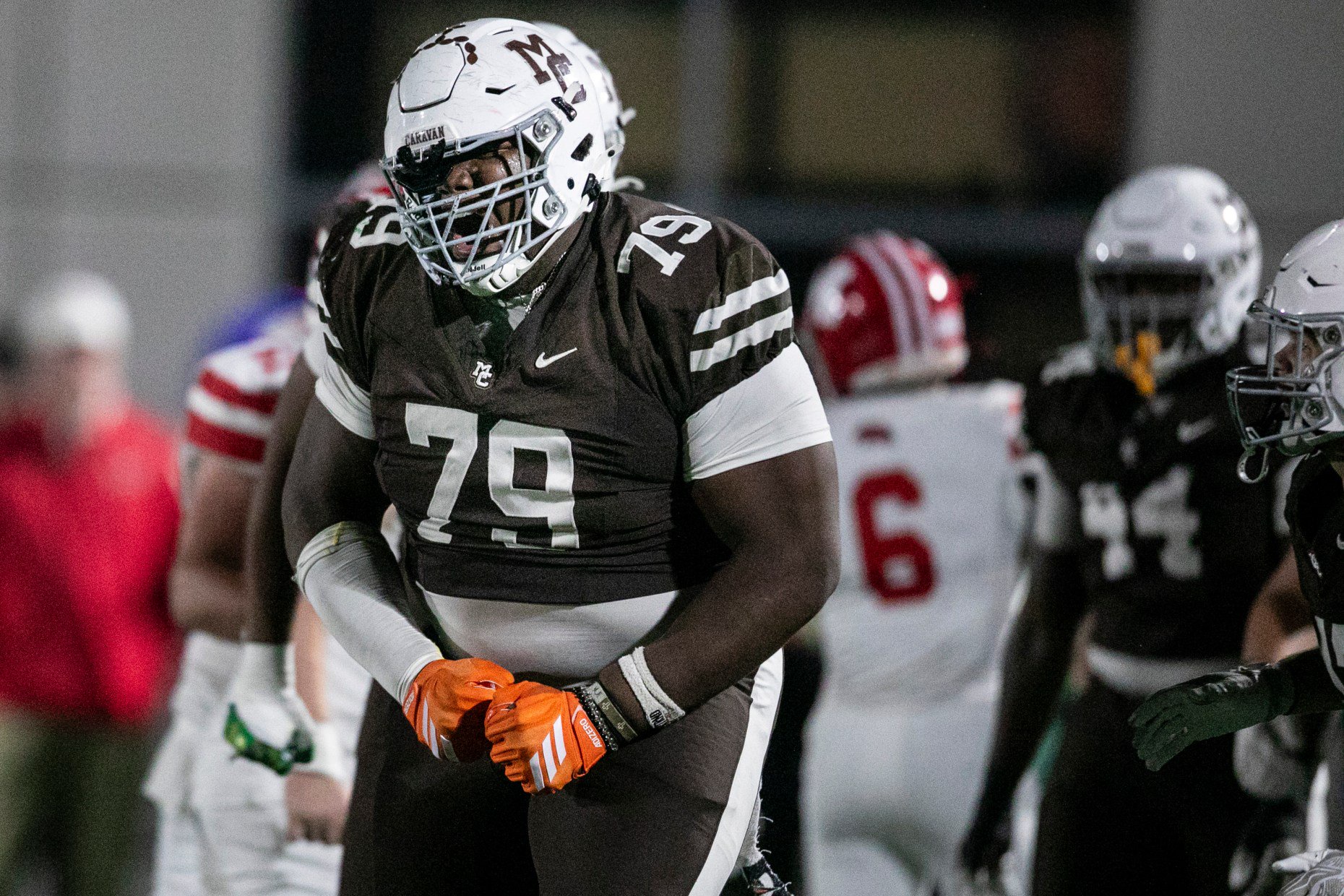 Mount Carmel's Caleb Tucker (79) reacts after sacking Maristâs quarterback...