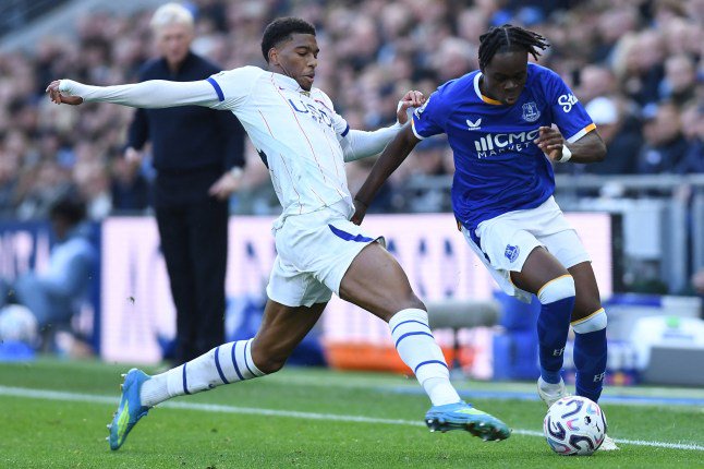 Chelsea's English defender #34 Josh-Kofi Acheampong (L) vies with Everton's English midfielder #19 Tyrique George (R) during the English Premier League football match between Everton and Chelsea at Hill Dickinson Stadium in Liverpool, north west England on October 17, 2026. (Photo by PETER POWELL / AFP via Getty Images) / RESTRICTED TO EDITORIAL USE. No use with unauthorized audio, video, data, fixture lists, club/league logos or 'live' services. Online in-match use limited to 120 images. An additional 40 images may be used in extra time. No video emulation. Social media in-match use limited to 120 images. An additional 40 images may be used in extra time. No use in betting publications, games or single club/league/player publications. /