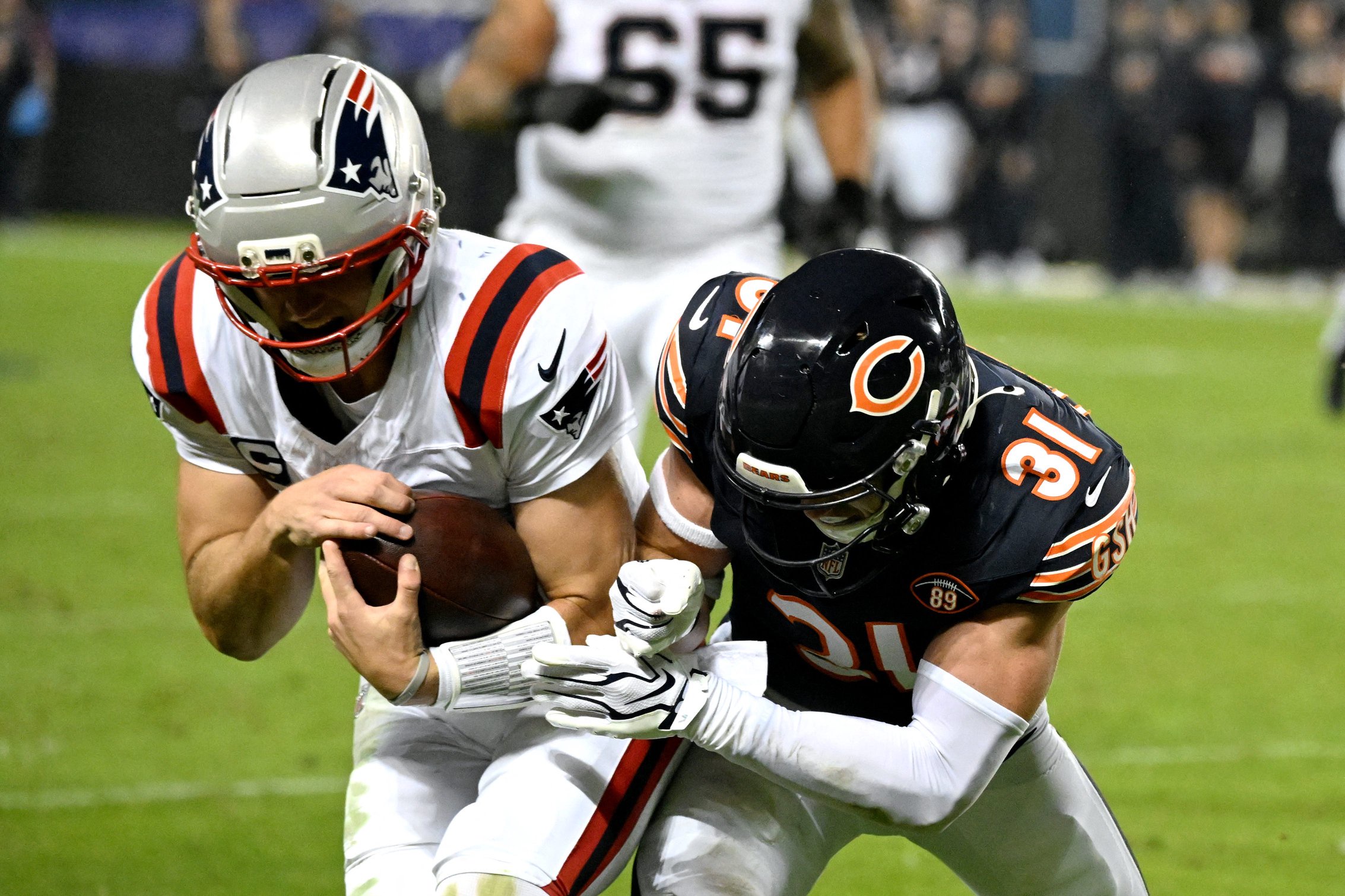 Oct 22, 2026; Chicago, Illinois, USA;  New England Patriots quarterback Drake Maye (10) is knocked out of bounds by Chicago Bears safety Dillon Thieneman (31) during the first half at Soldier Field.  Mandatory Credit: Matt Marton-Imagn Images
