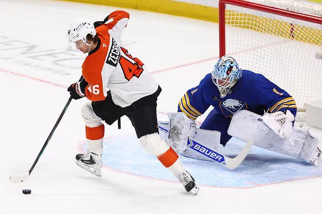Philadelphia Flyers center Trevor Zegras (46) controls the puck in front of Buffalo Sabres goaltender Ukko-Pekka Luukkonen (1) during the second period of an NHL hockey game Wednesday, Oct. 21, 2026, in Buffalo, N.Y. (AP Photo/Jeffrey T. Barnes)