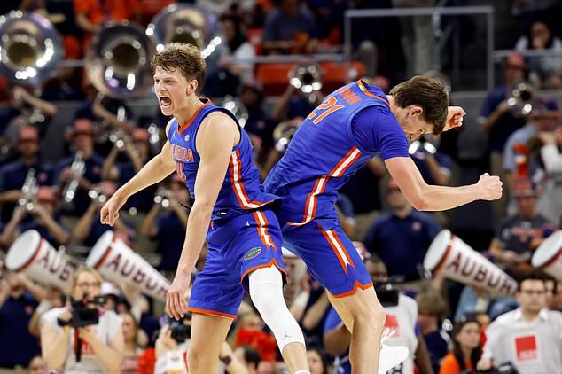 FILE - Florida forwards Thomas Haugh, left, and Alex Condon (21) celebrate after defeating Auburn in an NCAA college basketball game, Feb. 8, 2025, in Auburn, Ala. (AP Photo/Butch Dill, File)