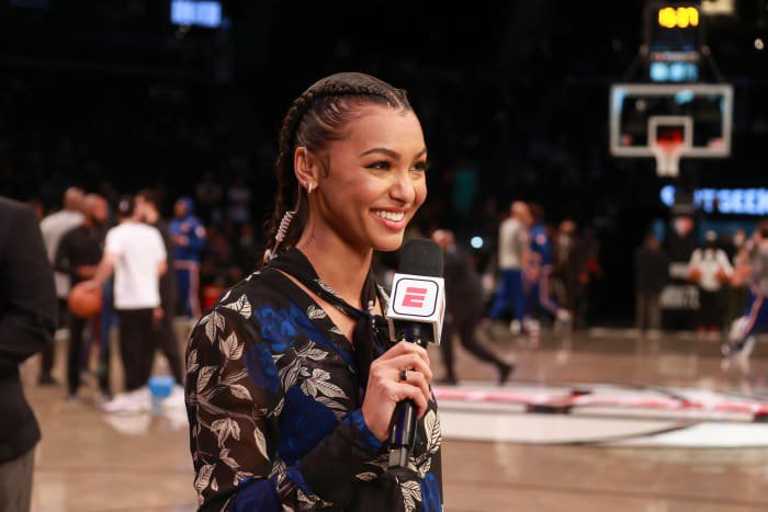 Malika Andrews on the sidelines for a Nets game.