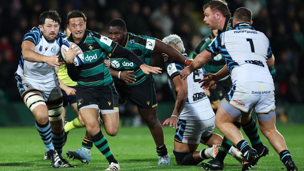 Alex Mitchell of Northampton Saints runs with the ball during his side's win against Cardiff