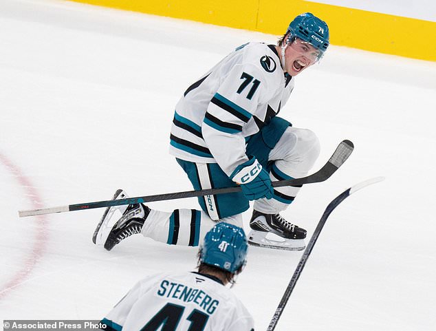 San Jose Sharks' Macklin Celebrini (71) celebrates his game-winning goal over the Montreal Canadiens during overtime in an NHL hockey game in Montreal, Tuesday, Oct. 20, 2026. (Christinne Muschi/The Canadian Press via AP)