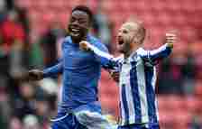 Barry Bannan celebrates victory with teammate Anthony Musaba of Sheffield Wednesday after avoiding relegation during the Sky Bet Championship match...