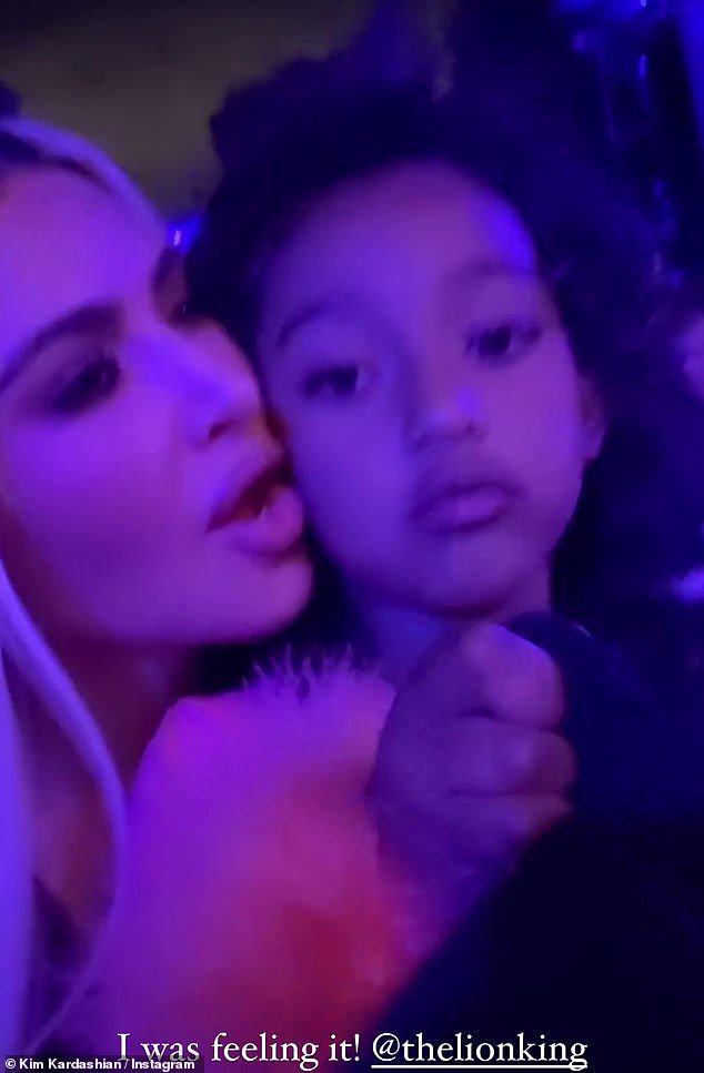 The SKIMS founder later uploaded a clip of herself watching the concert with daughter, Chicago, propped up on her lap