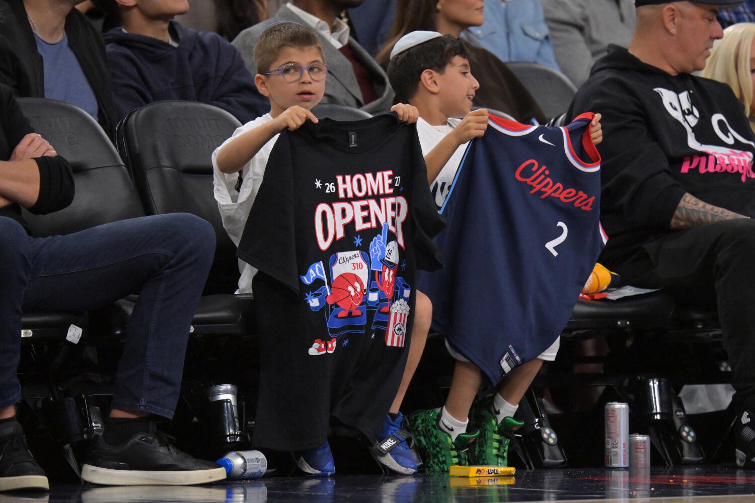 Young Clippers fans watch the team play the the Sacramento Kings Wednesday at the Intuit Dome.