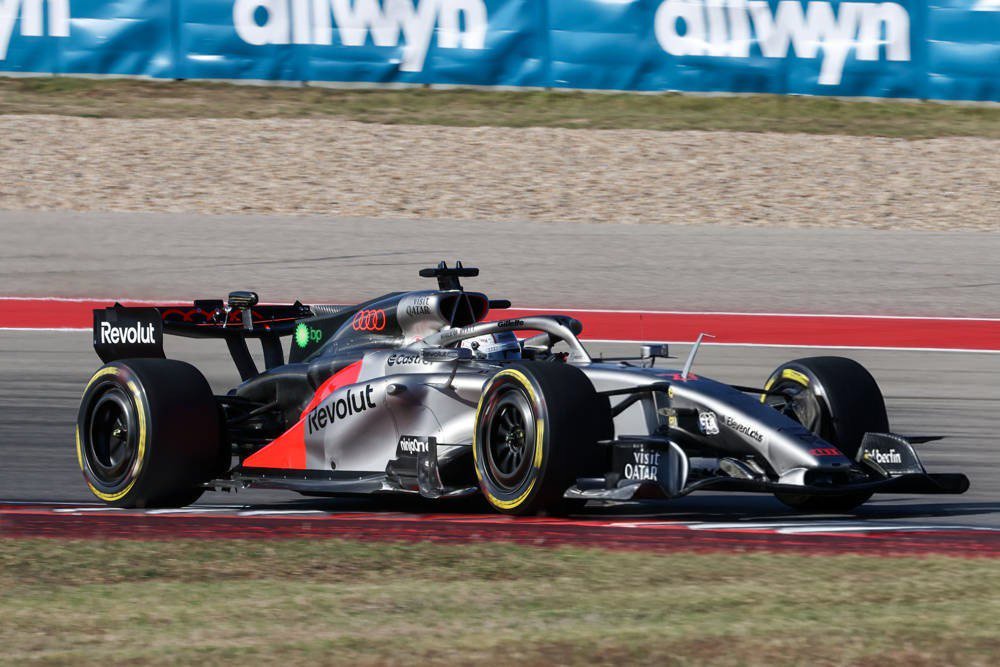 Audi F1 car with Revolut livery on track at the United States Grand Prix, with a Qatar Airways sponsor logo visible on the front wing.