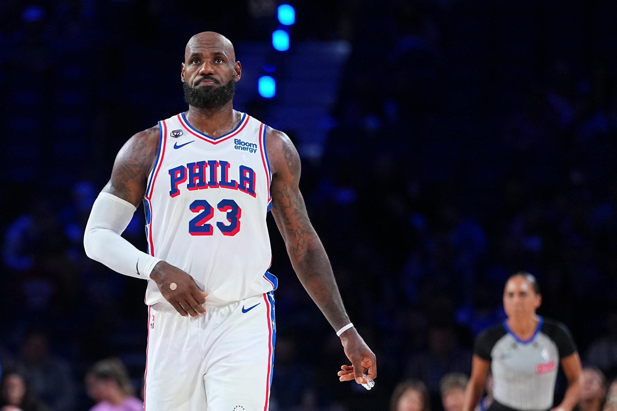 Philadelphia 76ers player standing on the court during a game against the Detroit Pistons.