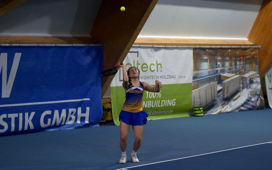 Rinnah Kim serves.
