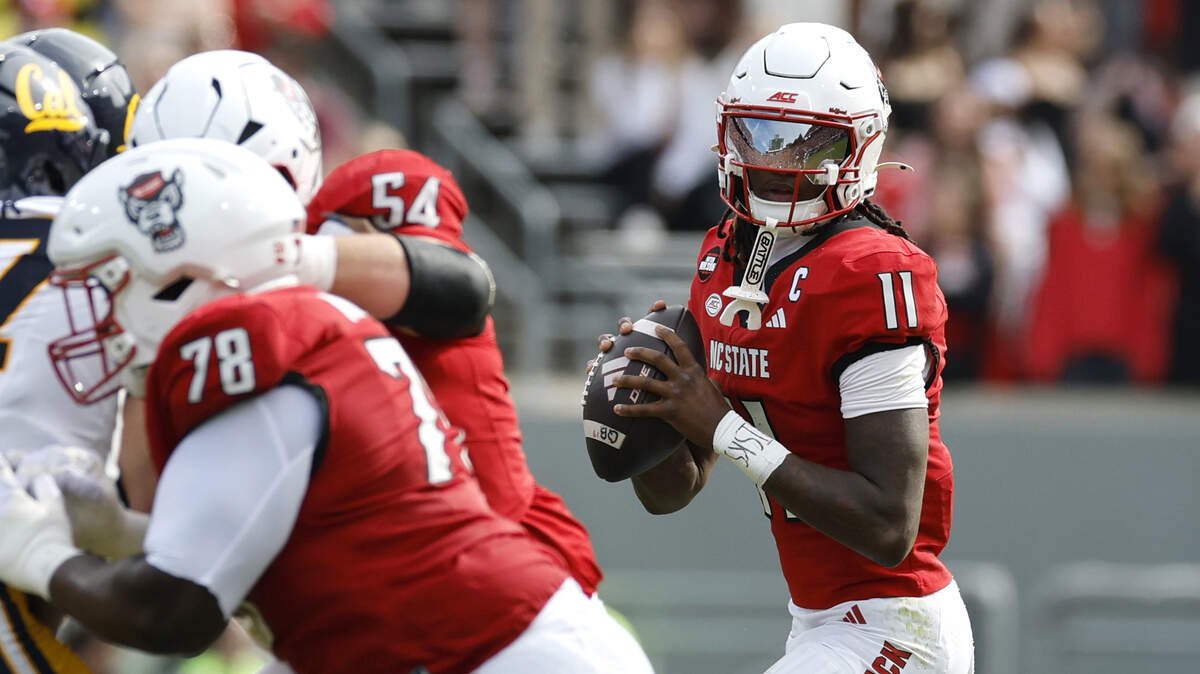 N.C. State quarterback CJ Bailey (11) looks for a receiver downfield in the first half of N.C. State’s game against California at Cater-Finley Stadium in Raleigh, N.C., Saturday, Oct. 31, 2026.