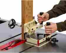 A tensioning jig being used on a table saw.