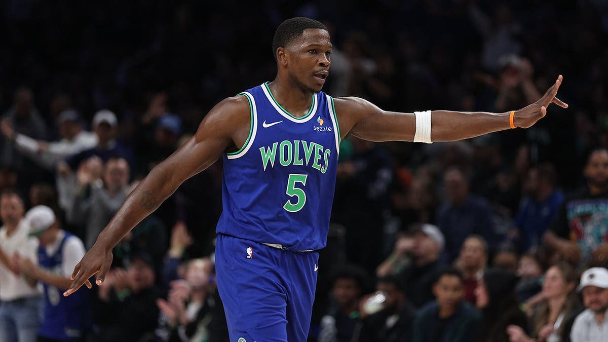 Anthony Edwards celebrates after scoring during an NBA game against the Toronto Raptors in Minneapolis.
