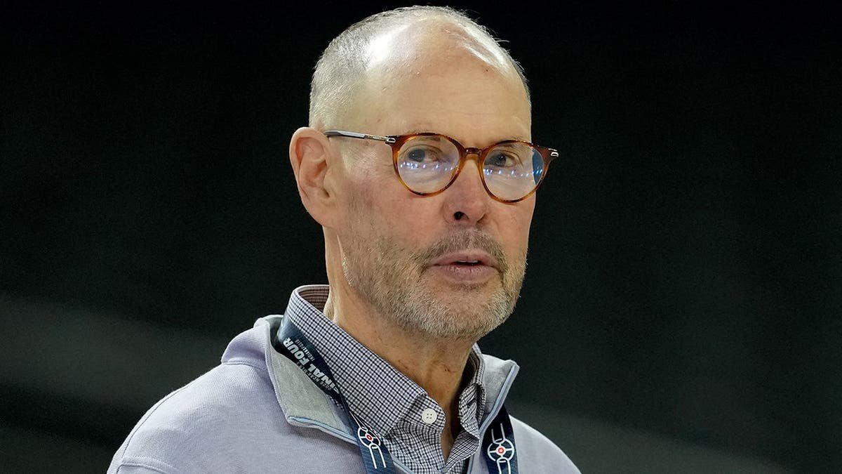 Ernie Johnson looks on during a practice session at Lucas Oil Stadium.