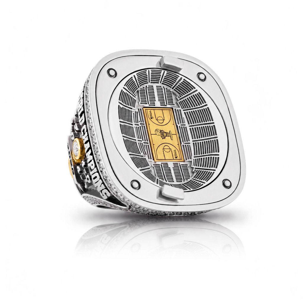 Knicks NBA championship ring featuring a miniature stadium and basketball court on the face.