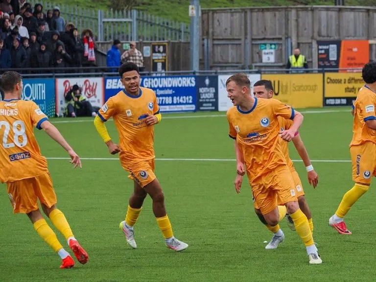 Bedford Town's Joe Payne leads celebrations with three teammates after scoring at Scarborough
