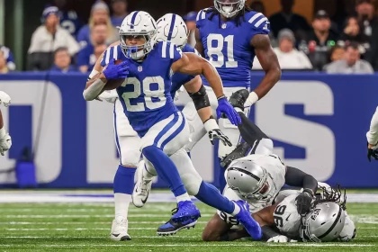 FootballR - NFL - Indianapolis Colts running back Jonathan Taylor runs with the ball.