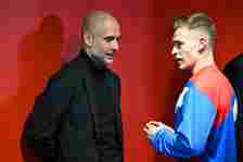 Pep Guardiola, Manager of Manchester City, speaks with Joshua Kimmich of FC Bayern Munich in the tunnel after the UEFA Champions League quarterfina...