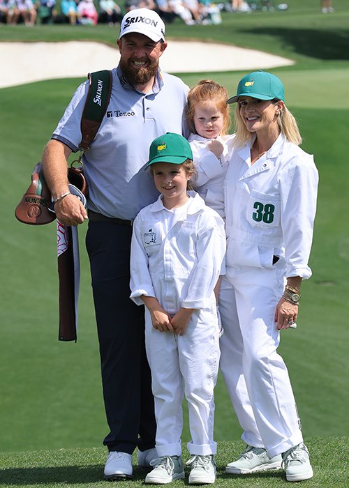 Shane Lowry poses with wife Wendy and children Iris and Ivy during the Par Three Contest prior to the 2025 Masters Tournament