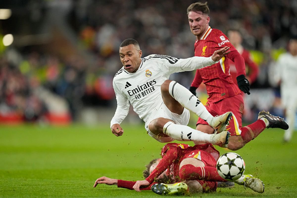 Kylian Mbappe centre-forward of Real Madrid and France and Conor Bradley right-back of Liverpool and Northern Ireland  compete for the ball during the UEFA Champions League 2024/25 League Phase MD5 match between Liverpool FC and Real Madrid C.F. at Anfield on November 27, 2024 in Liverpool, England. (Photo by Jose Breton/Pics Action/NurPhoto via Getty Images)