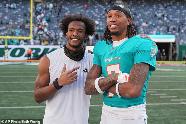 New York Jets wide receiver Garrett Wilson (5) poses for a photo with Miami Dolphins wide receiver Caleb Douglas (7) after Sunday's narrow loss in East Rutherford, New Jersey