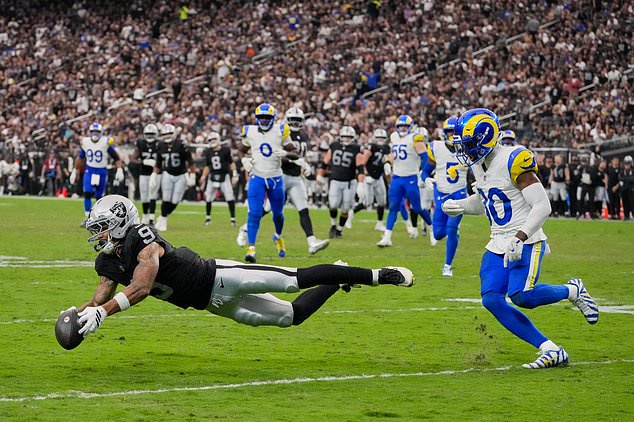 Las Vegas Raiders wide receiver Jalen Nailor, left, attempts to make a catch in front of Los Angeles Rams cornerback Josh Wallace during the second half of an NFL football game Sunday, Oct. 25, 2026, in Las Vegas. (AP Photo/John Locher)