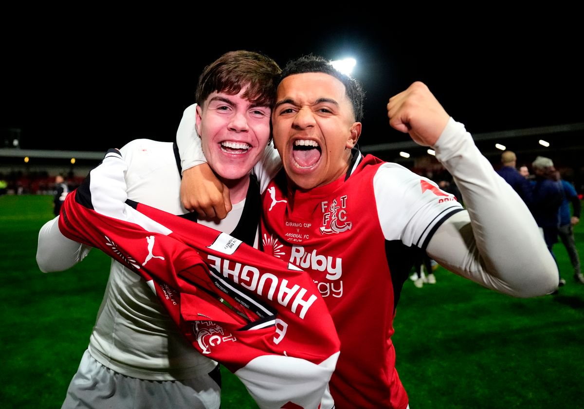 Fleetwood Town's Conor Haughey (left) celebrates scoring the winning penalty in the shoot-out with team-mate Rafaele Cirino