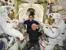Boeing crew flight test astronauts Suni Williams and Butch Wilmore, center, pose with Expedition 71 flight engineers Mike Barratt, left, and Tracy Dyson, both NASA astronauts, in their spacesuits aboard the International Space Station's Quest airlock on June 24, 2024.