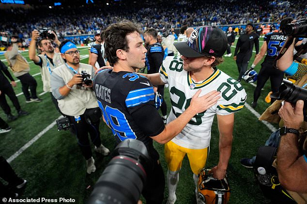 Detroit Lions kicker Jake Bates (39) talks with Green Bay Packers kicker Trey Smack (28) after an NFL football game, Sunday, Oct. 25, 2026, in Detroit. (AP Photo/Paul Sancya)