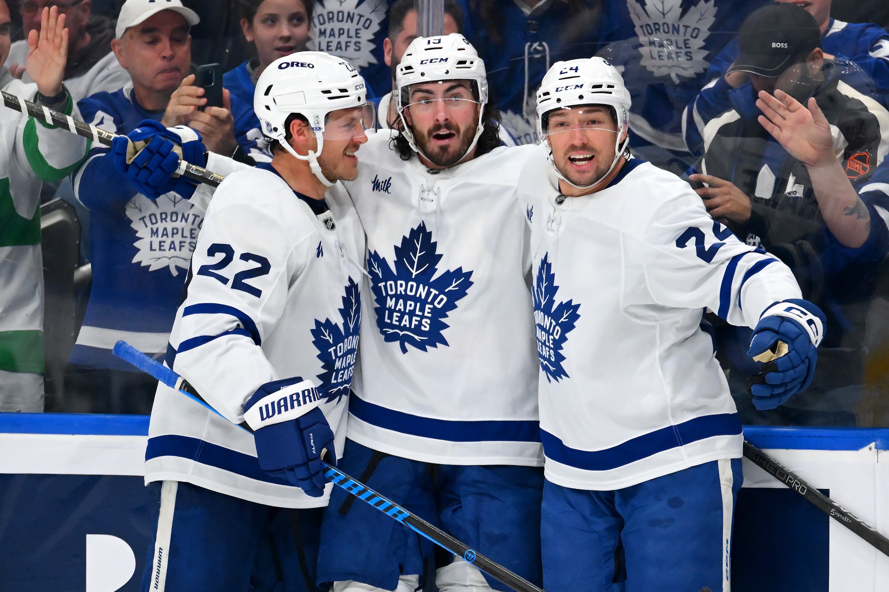EDMONTON, CANADA - OCTOBER 24: Jake McCabe #22, Brandon Duhaime #24 and Zack MacEwen #19 of the Toronto Maple Leafs celebrate a third-period goal against the Edmonton Oilers during the game at Rogers Place on October 24, 2026, in Edmonton, Alberta, Canada. (Photo by Leila Devlin/Getty Images)