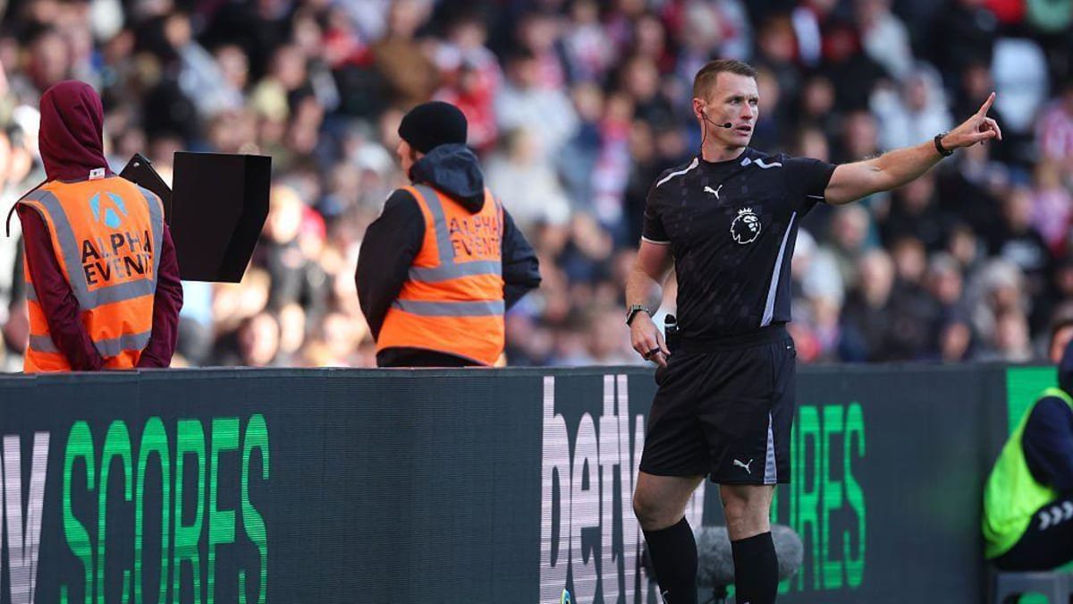 Referee Thomas Bramall checks the VAR monitor
