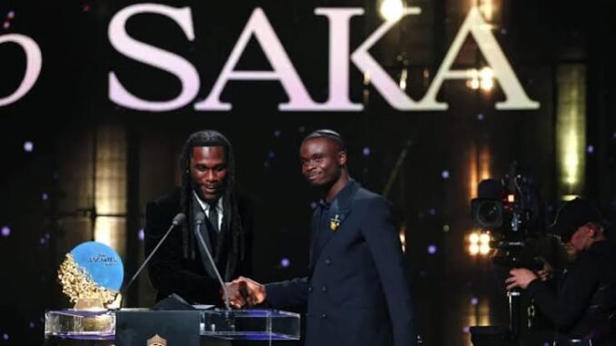 Burna Boy presents Socrates Award to Bukayo Saka at 2026 Ballon d’Or